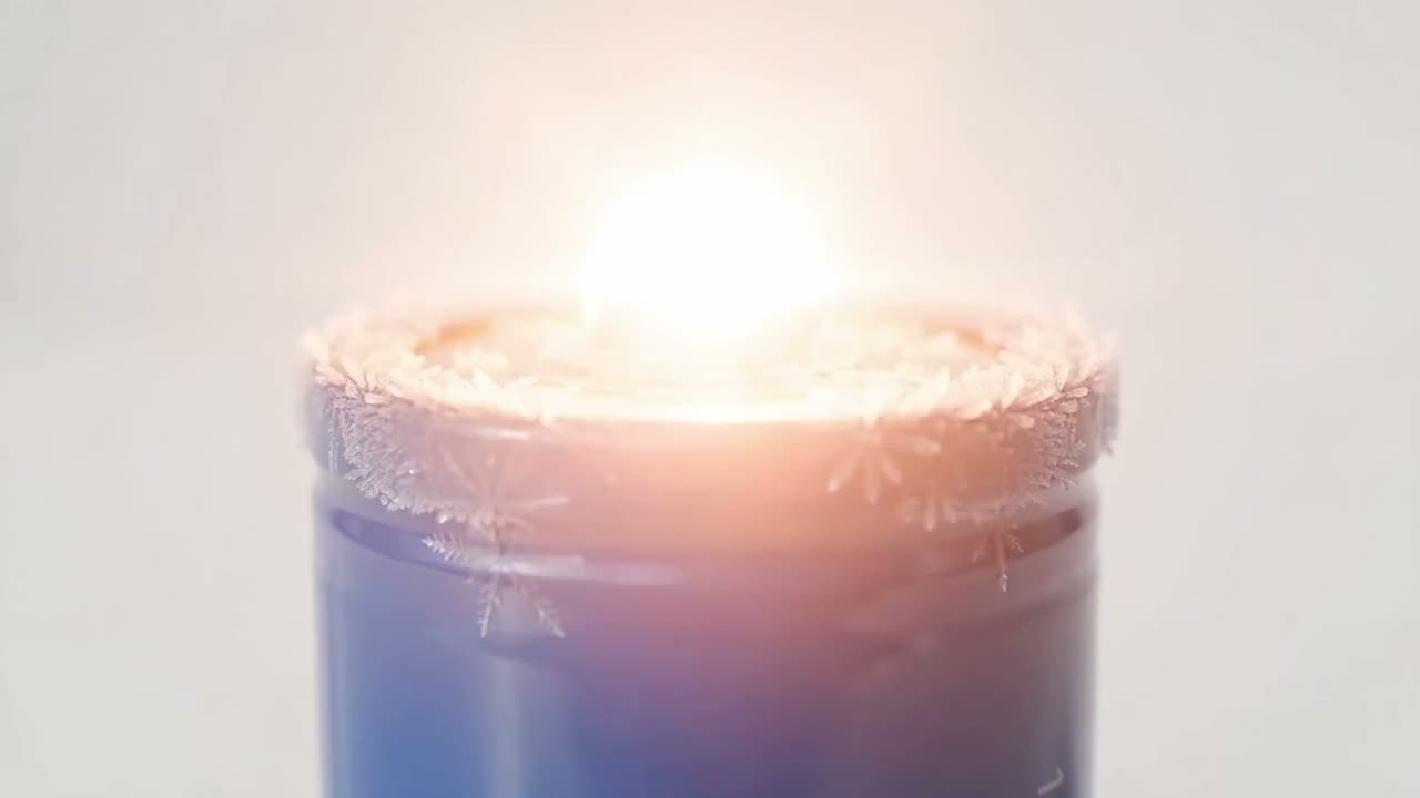 A cylindrical cell bursts open in a flash of light