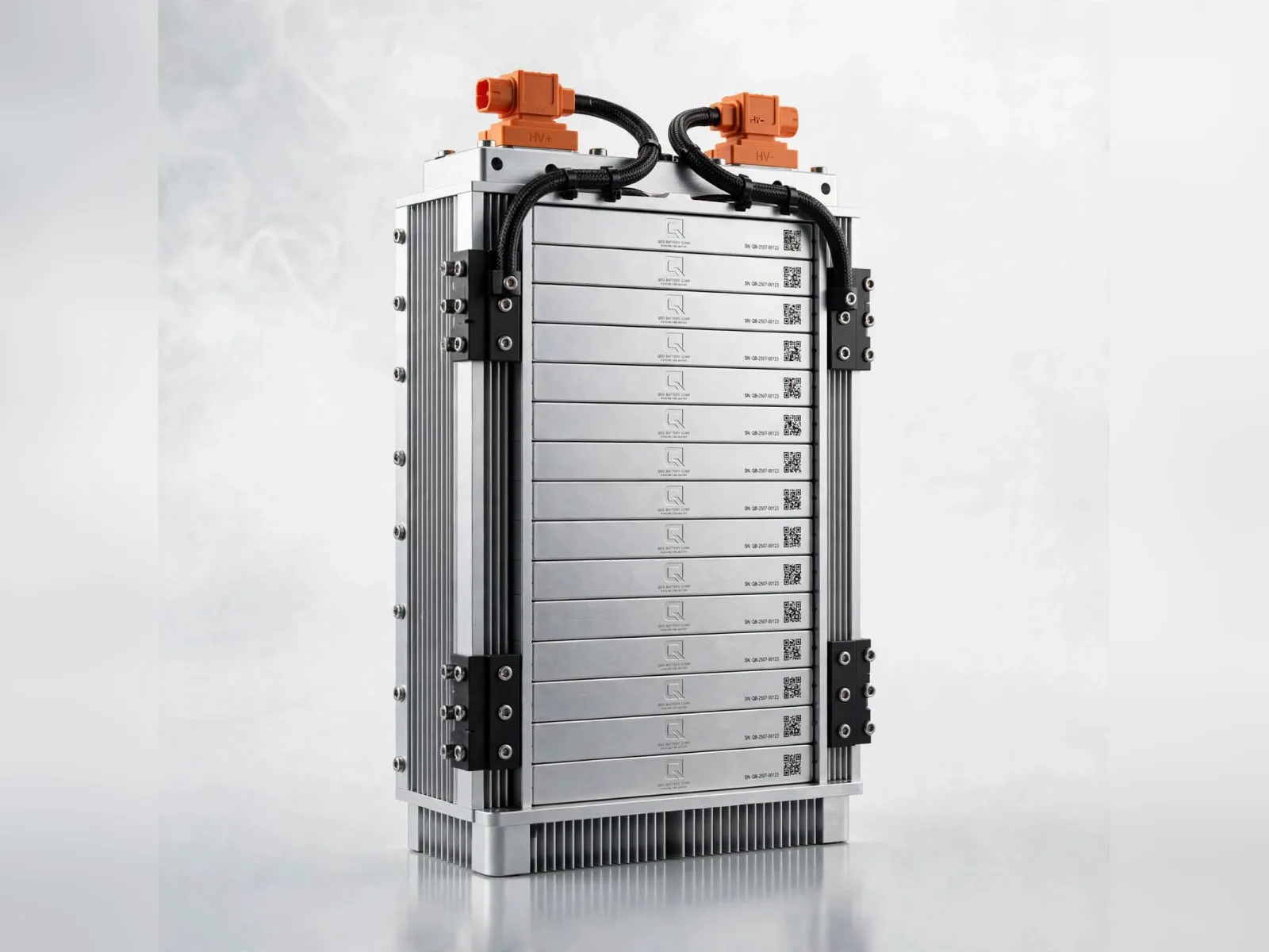 A QED module: flat prismatic cells stacked in an aluminium frame with high-voltage connectors on top, concept render